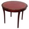 Walnut card table with pie crust top and red vinyl inset and thin brass trim. It comes with 2 15” leaves.